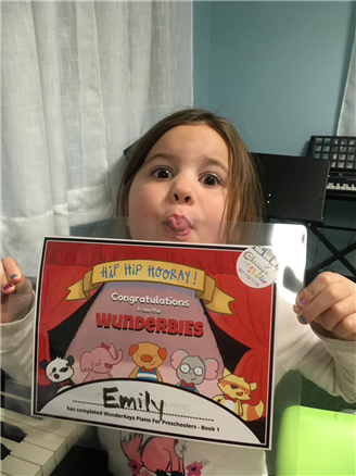 Emily has finished her first WunderKeys book!