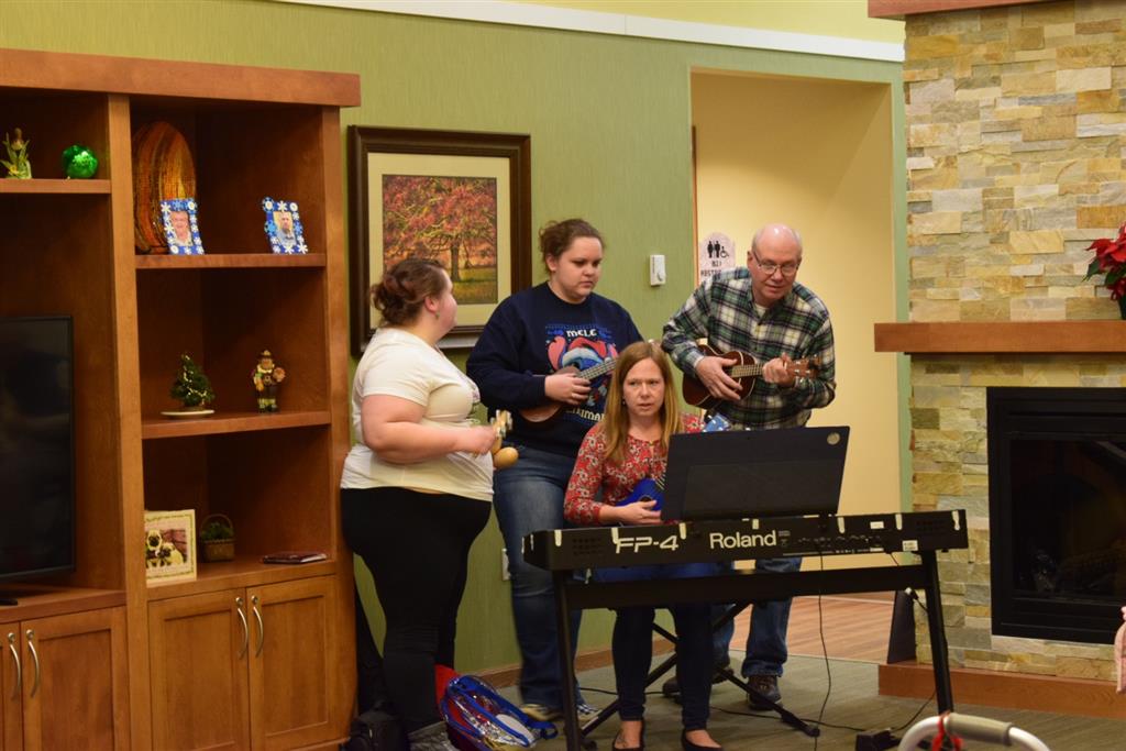 Chrissy, Angie, Jill, & Gary got out the ukes, sleigh bells, and maracas for Felix Navidad and Silver Bells.