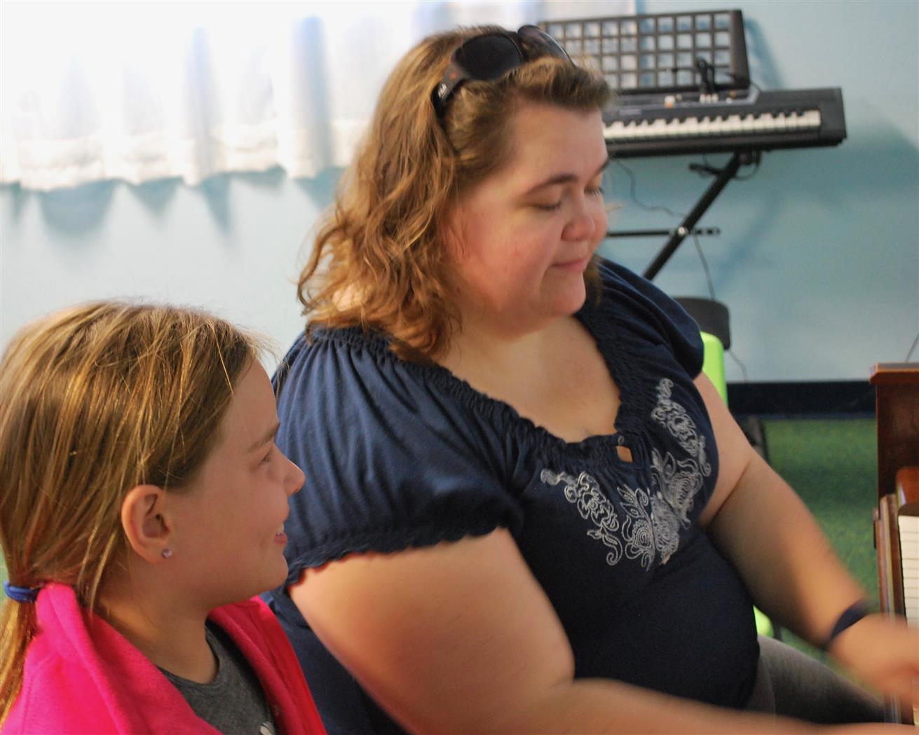 Paige & Chrissy having a laugh during a voice lesson.